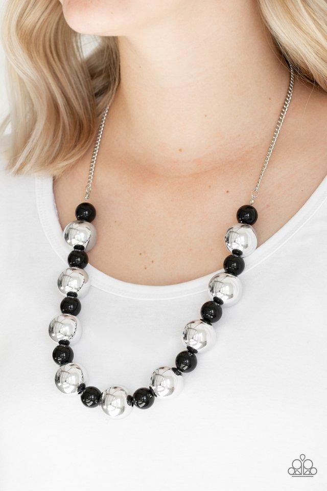 Top Pop Black and Silver Necklace - Paparazzi Accessories- on model - CarasShop.com - Paparazzi Jewelry by Cara Jewels