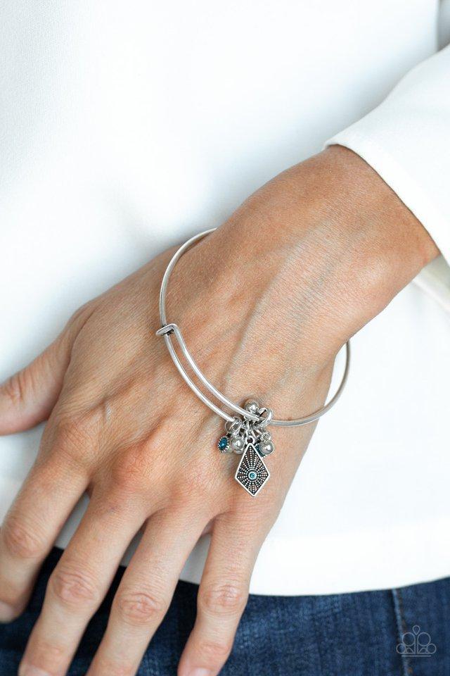 Treasure Charms Blue and Silver Charm Bangle Bracelet - Paparazzi Accessories- on model - CarasShop.com - Paparazzi Jewelry by Cara Jewels