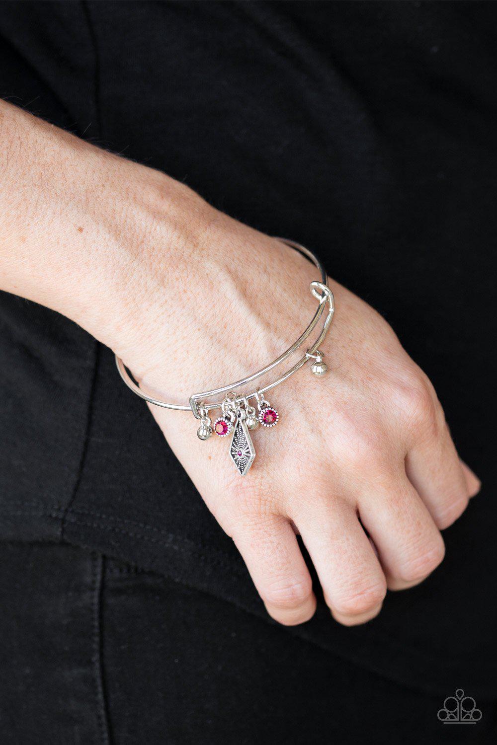 Treasure Charms Pink Charm Bangle Bracelet - Paparazzi Accessories- on model - CarasShop.com - Paparazzi Jewelry by Cara Jewels