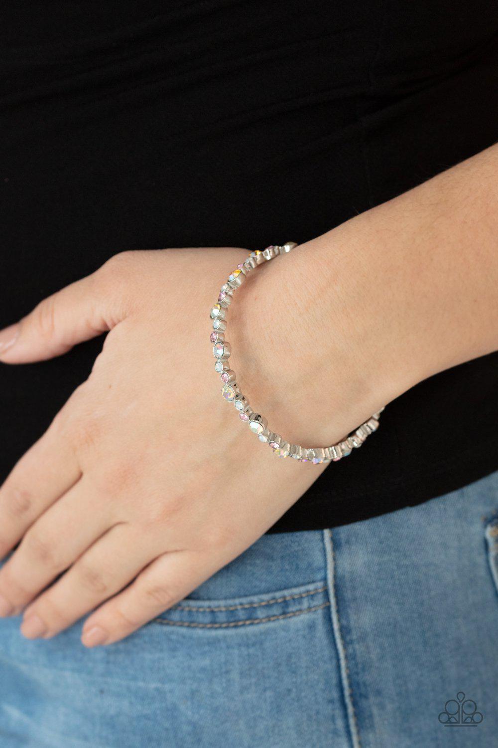 Twinkly Trendsetter Multi Pink, White and Iridescent Rhinestone Bangle Bracelet - Paparazzi Accessories- on model - CarasShop.com - Paparazzi Jewelry by Cara Jewels