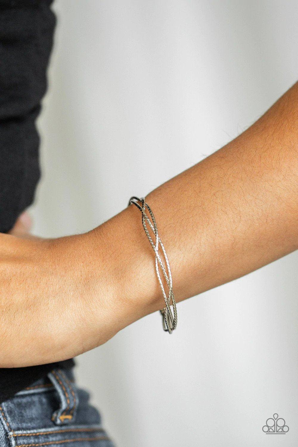 Twist of the Wrist Silver Cuff Bracelet - Paparazzi Accessories- on model - CarasShop.com - Paparazzi Jewelry by Cara Jewels