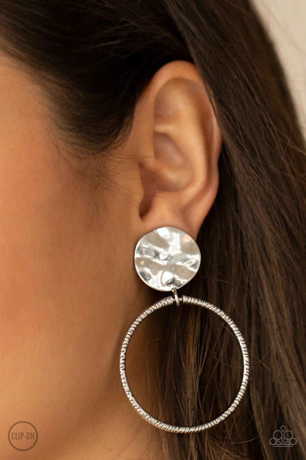 Undeniably Urban Silver Clip-on Earrings - Paparazzi Accessories- on model - CarasShop.com - Paparazzi Jewelry by Cara Jewels