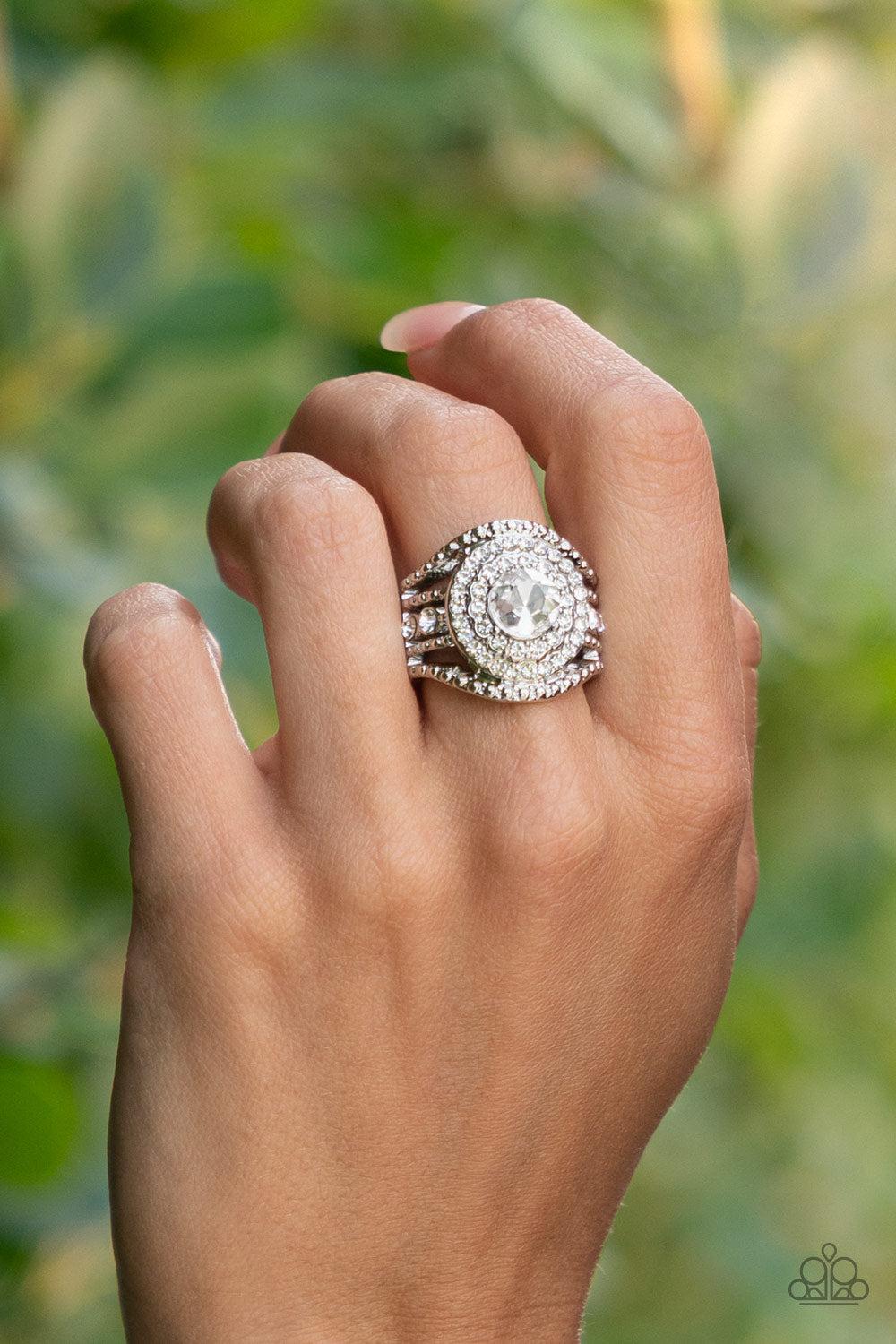 Understated Drama White Rhinestone Ring - Paparazzi Accessories- on model - CarasShop.com - Paparazzi Jewelry by Cara Jewels