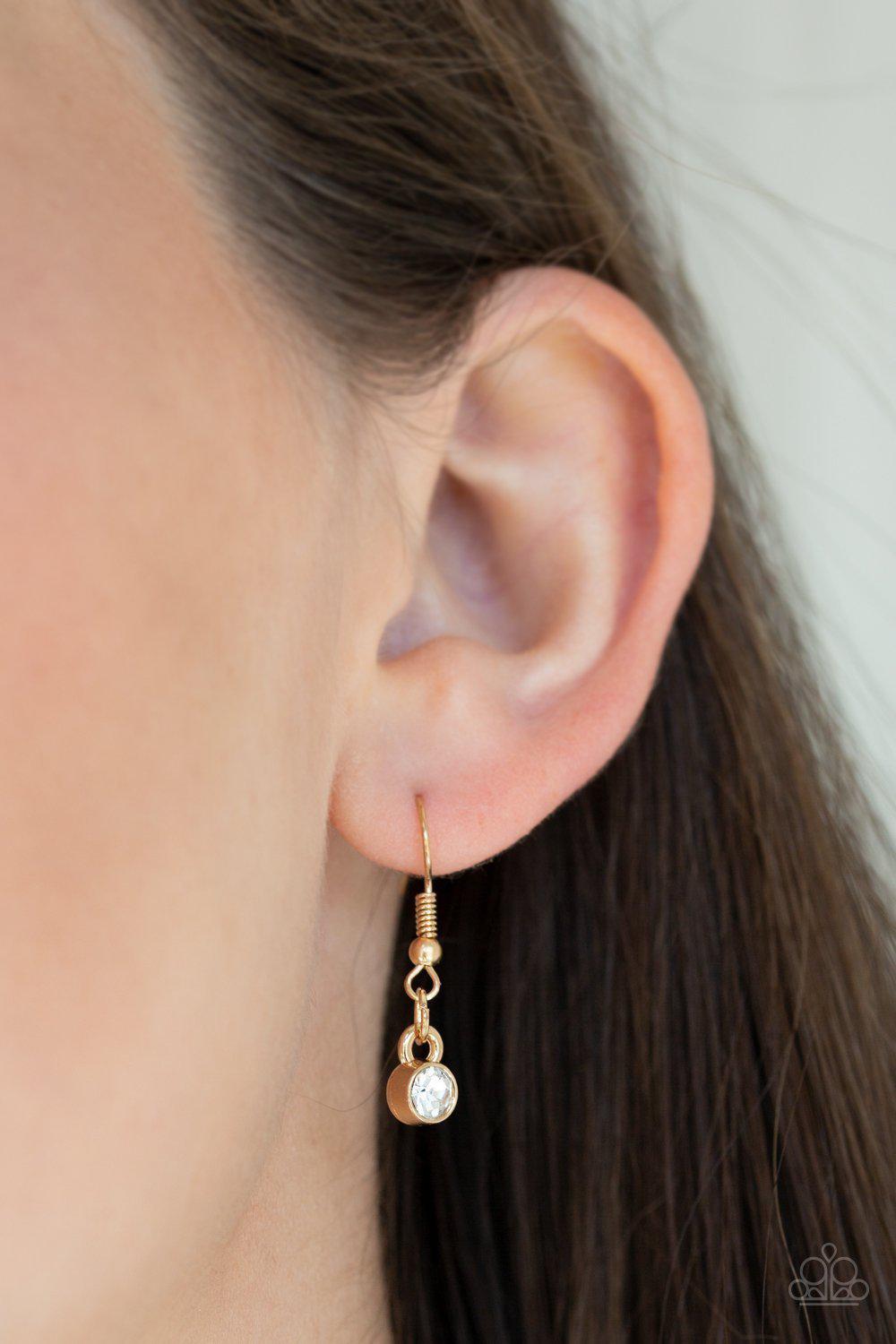 Urban District Gold and White Rhinestone Necklace - Paparazzi Accessories- on model - CarasShop.com - Paparazzi Jewelry by Cara Jewels