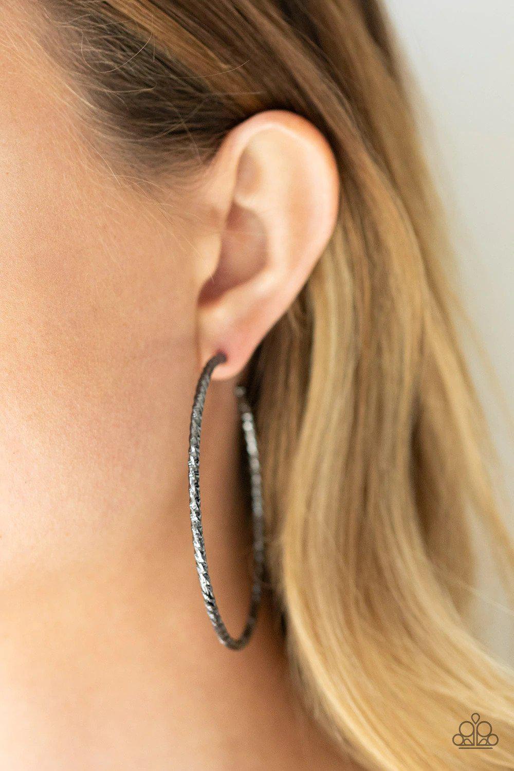 Voluptuous Volume Gunmetal Black Hoop Earrings - Paparazzi Accessories- on model - CarasShop.com - Paparazzi Jewelry by Cara Jewels