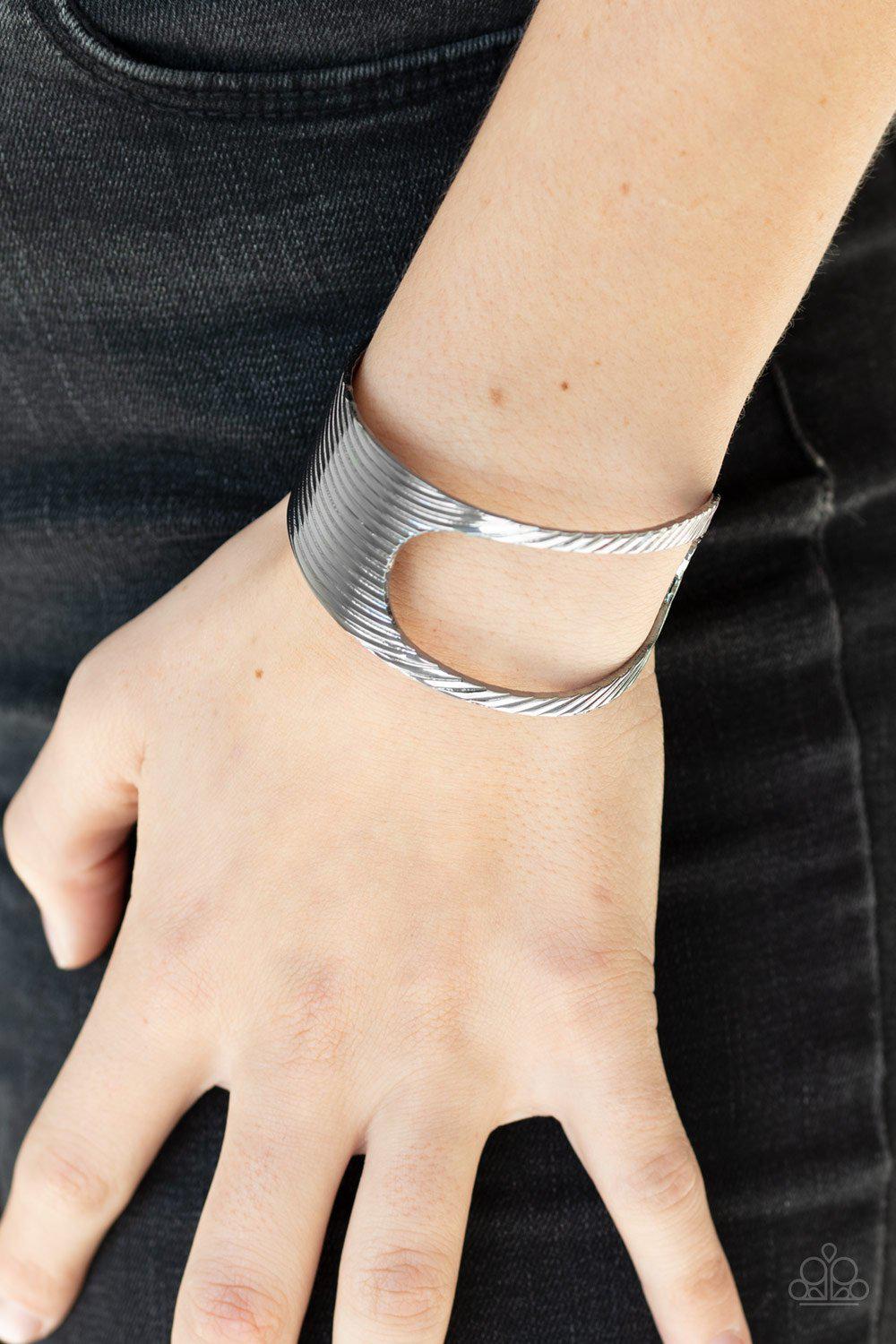What GLEAMS Are Made Of Black Gunmetal Cuff Bracelet - Paparazzi Accessories- on model - CarasShop.com - Paparazzi Jewelry by Cara Jewels