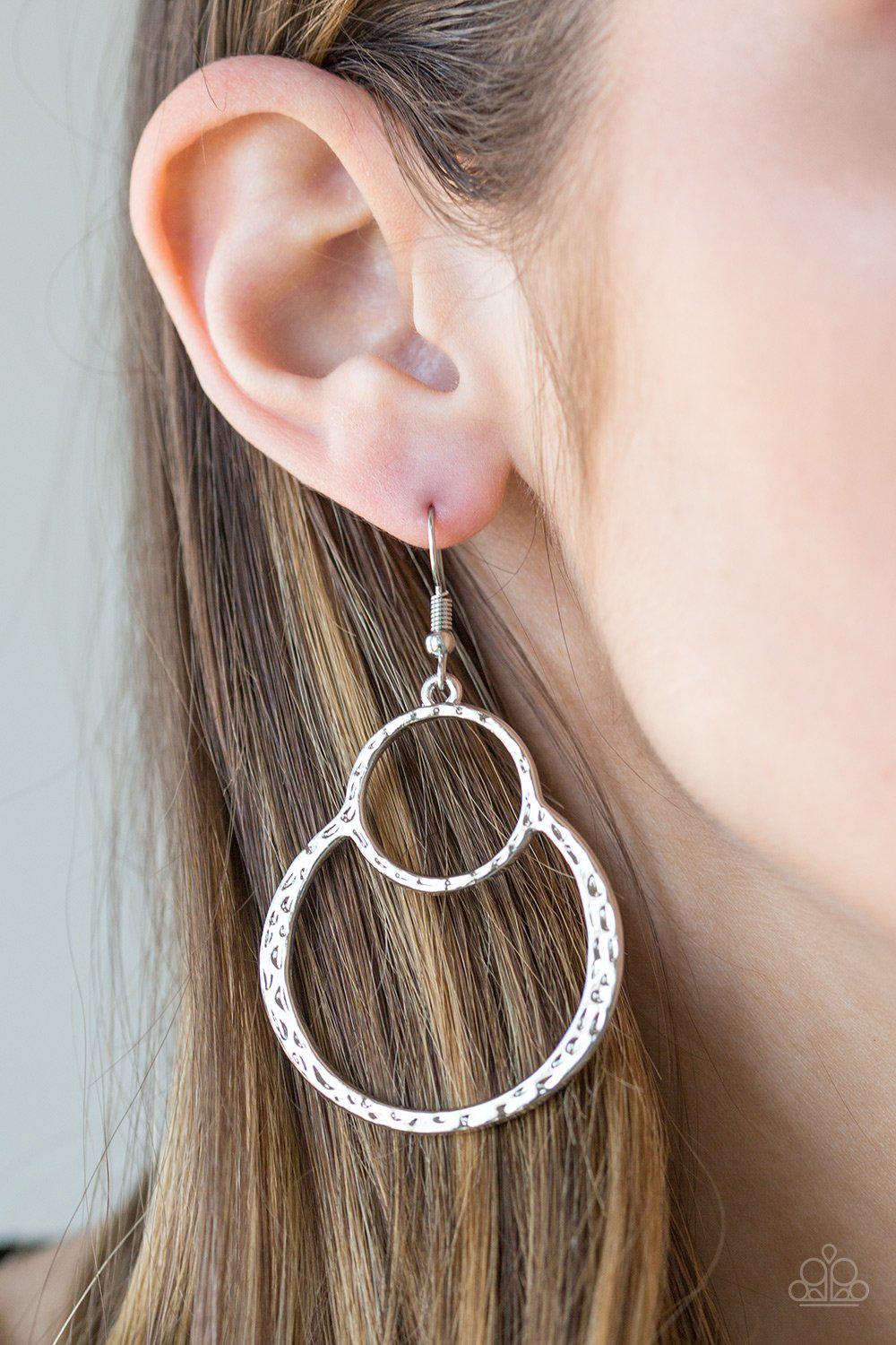 Zen Out Of Zen Silver Hoop Earrings - Paparazzi Accessories- on model - CarasShop.com - Paparazzi Jewelry by Cara Jewels